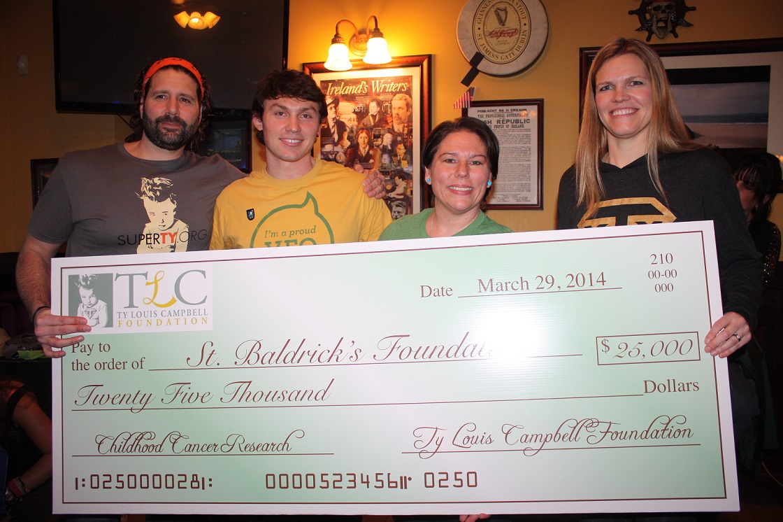 The Ty Louis Campbell Foundation presented a check to the St. Baldrick's Foundation to help fund childhood cancer research