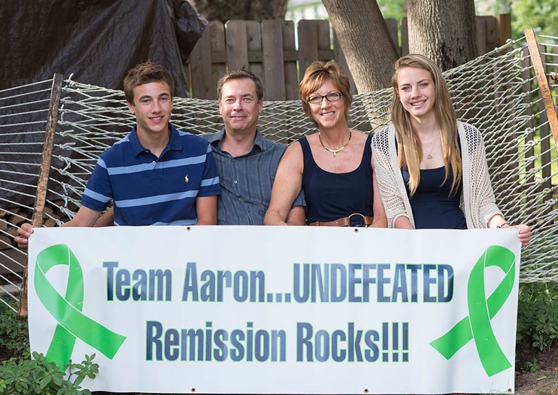 Ambassador Aaron and his family proudly displays a 'Team Aaron' banner.