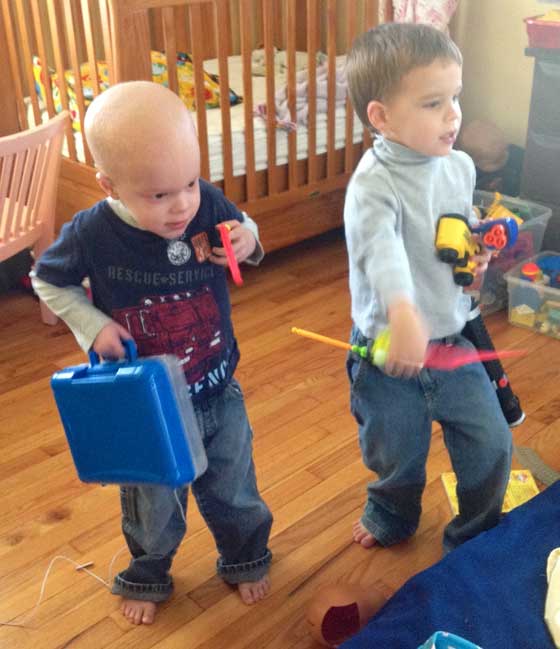 Aidan and Chase play carefully around his IV bag.