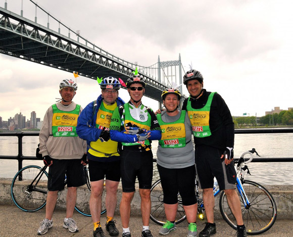 Susan and her cycling friends in front of the Robert F. Kennedy Bridge during the Five Boro Bike Tour.