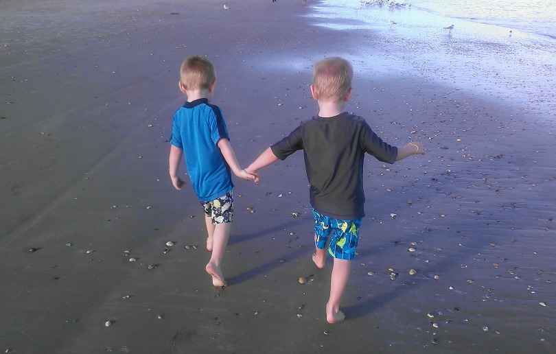 Will and Benjamin walk on the beach