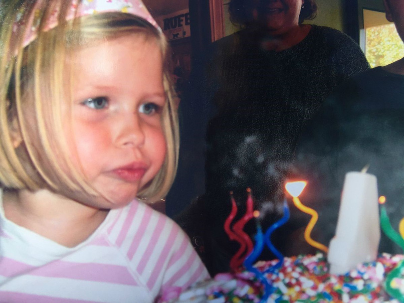 Sara blowing out birthday candles days before her Wilms tumor diagnosis