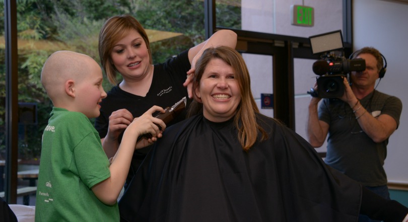 Kelly getting her head shaved by her son
