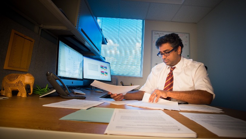Dr. Nickhill Bhakta at his desk