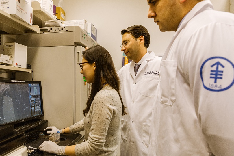 Dr. Alex Kentsis in the lab with his colleagues